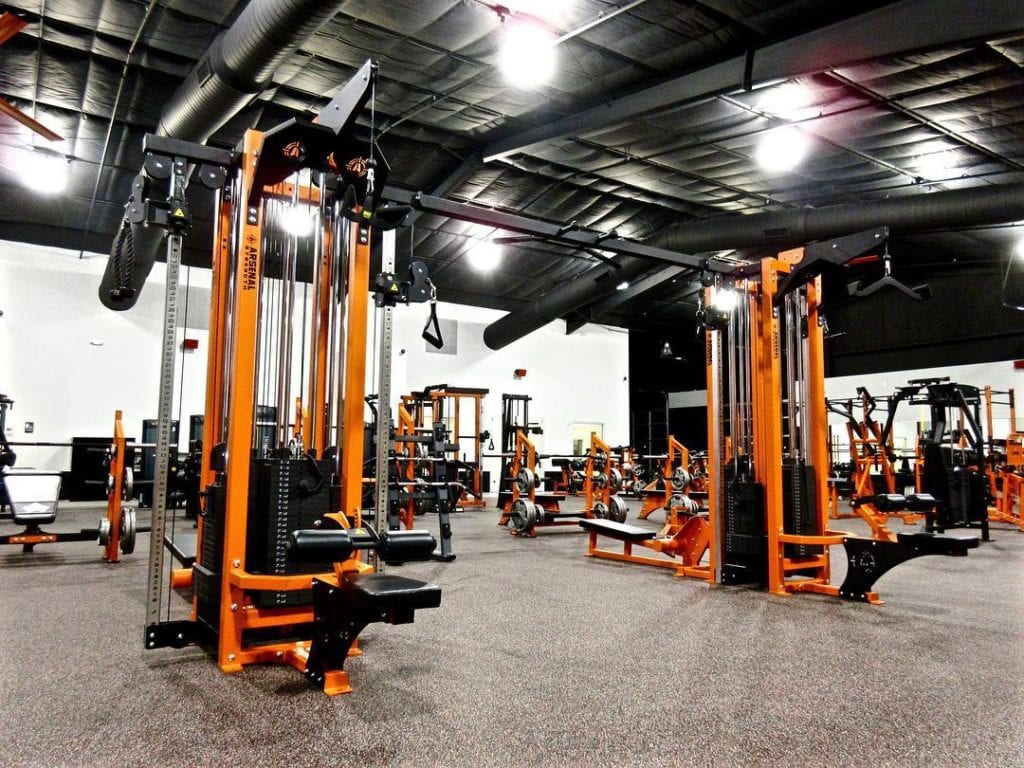 A variety of orange and black gym equipment
